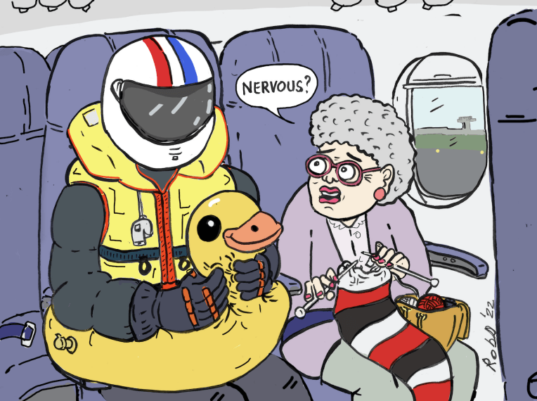 A lady is seated knitting a scarf as she sits in her seat in an aircraft. The passenger next to her wears a motorbike helmet, a Childs duck swim ring and a life jacket. The lady asks them if they're nervous.